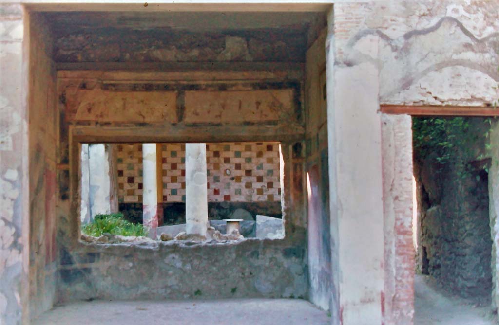 III.2.1 Pompeii, 7th August 1976. 
Looking north across tablinum to peristyle, with doorway to rear corridor and peristyle, on right.
Photo courtesy of Rick Bauer, from Dr.George Fay’s slides collection.