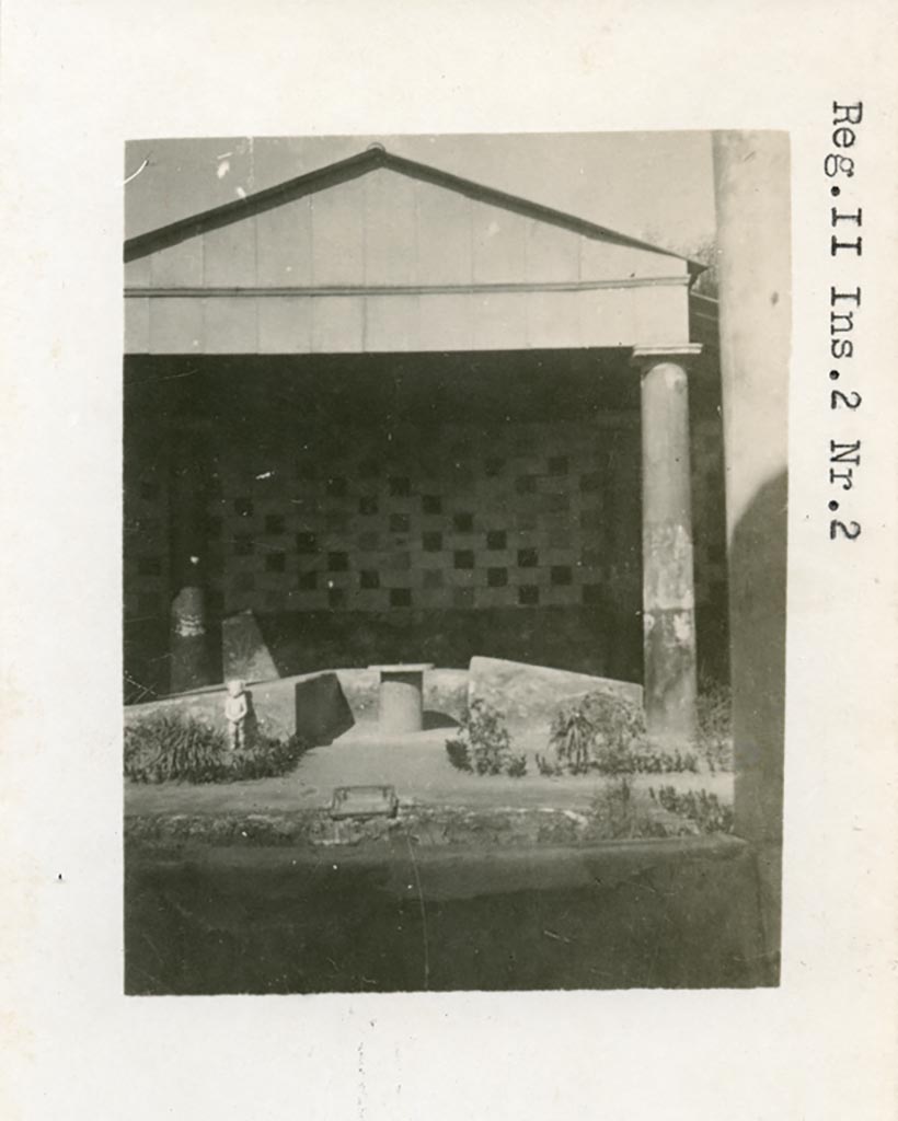III.2.1 Pompeii but numbered as II.2.2 on photo. Pre-1937-1939. 
Room 20, looking north towards summer triclinium with statue of cupid in situ.,
Photo courtesy of American Academy in Rome, Photographic Archive. Warsher collection no. 392.