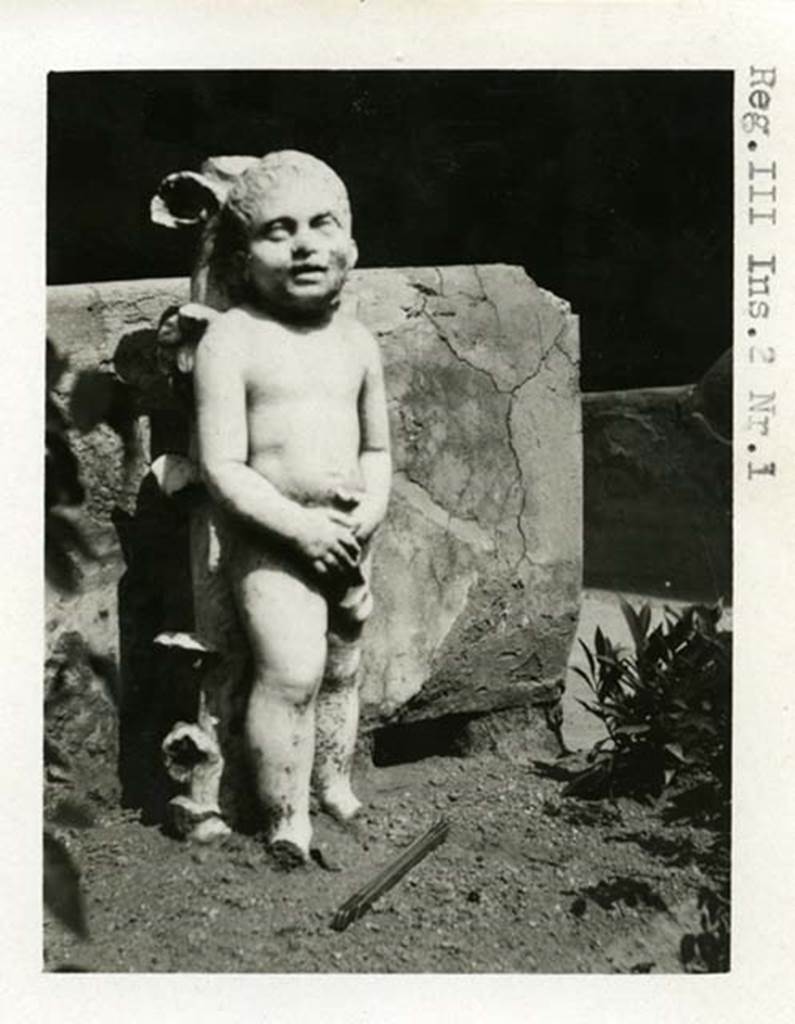 III.2.1 Pompeii. 1937-39. Room 20, statue of cupid. Photo courtesy of American Academy in Rome, Photographic Archive. Warsher collection no. 1920a