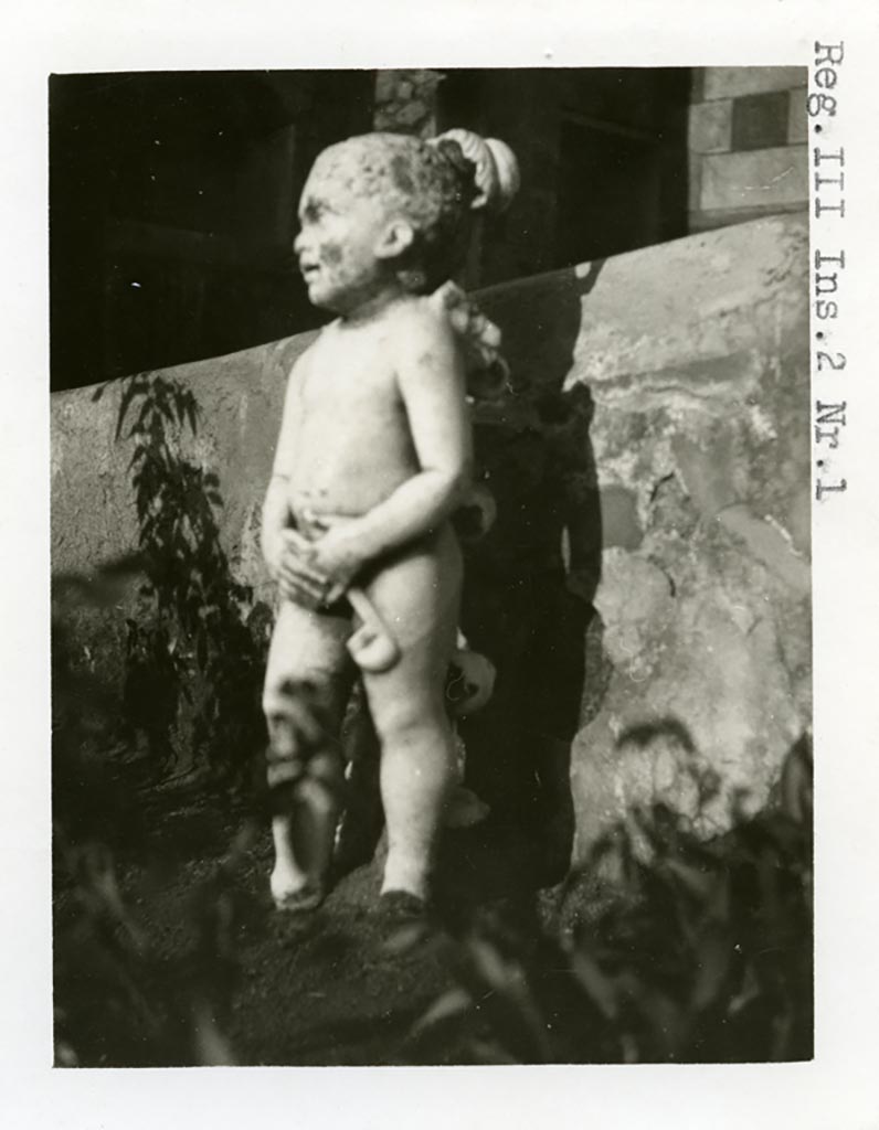 III.2.1 Pompeii. Pre-1937-39. Room 20, marble statuette of cupid.
Photo courtesy of American Academy in Rome, Photographic Archive. Warsher collection no. 1920.