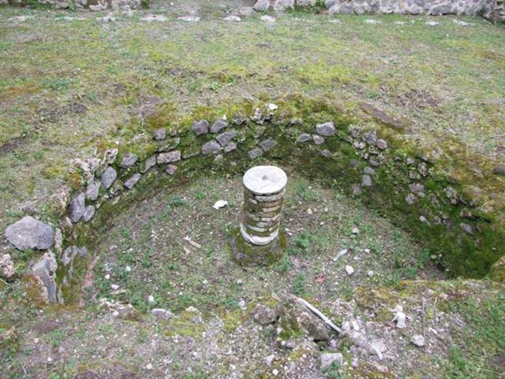 III.2.1 Pompeii. March 2009. Room 20, summer triclinium and garden area. Semi-circular pool, looking south.
According to Jashemski –
“The semi-circular pool (3.00m wide; 0.95m deep) in front of the triclinium had 12 fountain jets around the edge and another rose from the small column (0.39m high) in the centre of the pool. A pipe leading from an amphora placed on a large masonry pillar in the north-east corner of the peristyle carried water to both the jet in the middle of the table and to those in the pool. Spano suggests that this device was used to supply water after the aqueduct was damaged by the earthquake.”
Jashemski sources –
Spano, N.Sc (1915), p.429; N.Sc (1916), p.231-234 and fig,2 (plan) on p.232;
Spinazzola, N.Sc (1916), p.149-151;
Thedenat, p.88-89;
Soprano, p.297-298, no.8, and fig, 32 on p.297;
Spinazzola, Scavi Nuovi, p.292-296, and fig.312 (plan) on p.281, and figs.331-333 on p.294-6.
See Jashemski, W. F., 1993. The Gardens of Pompeii, Volume II: Appendices. New York: Caratzas. (p.99).
