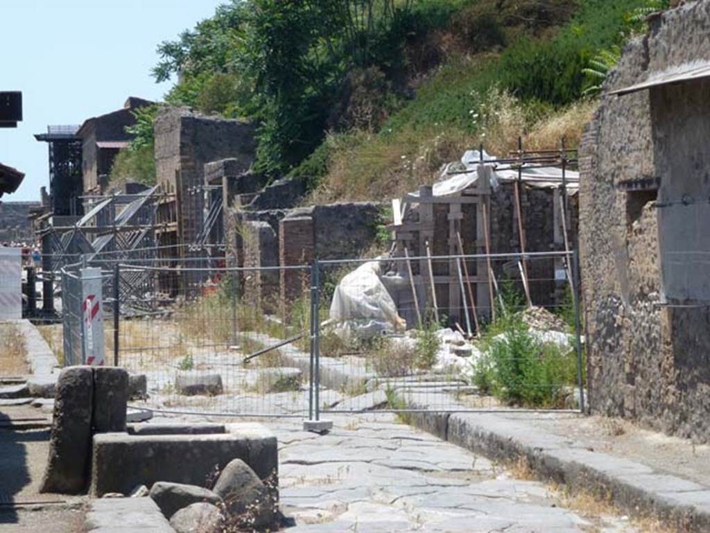 III.3.6 (centre) and III.4.1(on right) Pompeii. June 2012. Looking west along north side of Via dell’Abbondanza. Photo courtesy of Michael Binns.