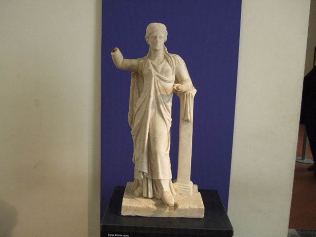 III.4.3 Pompeii. Garden area.  Marble statue of standing Isis found on a high pedestal in the middle of the garden.
See Jashemski, W. F., 1993. The Gardens of Pompeii, Volume II: Appendices. New York: Caratzas. (p.102-103) 
Now in Naples Archaeological Museum.
According to Della Corte – this white marble statue standing in the centre of the garden was of Diana Parthenos.
See Della Corte, M. Pompeji, the new excavations – houses and inhabitants 1925. (p.60).