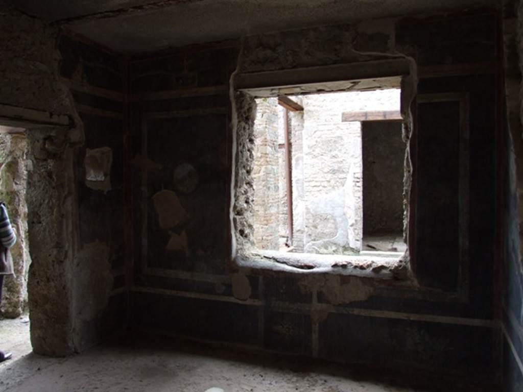 III.4.3  Pompeii.  March 2009.   Room 13.  West wall, with window overlooking garden Room 14.
