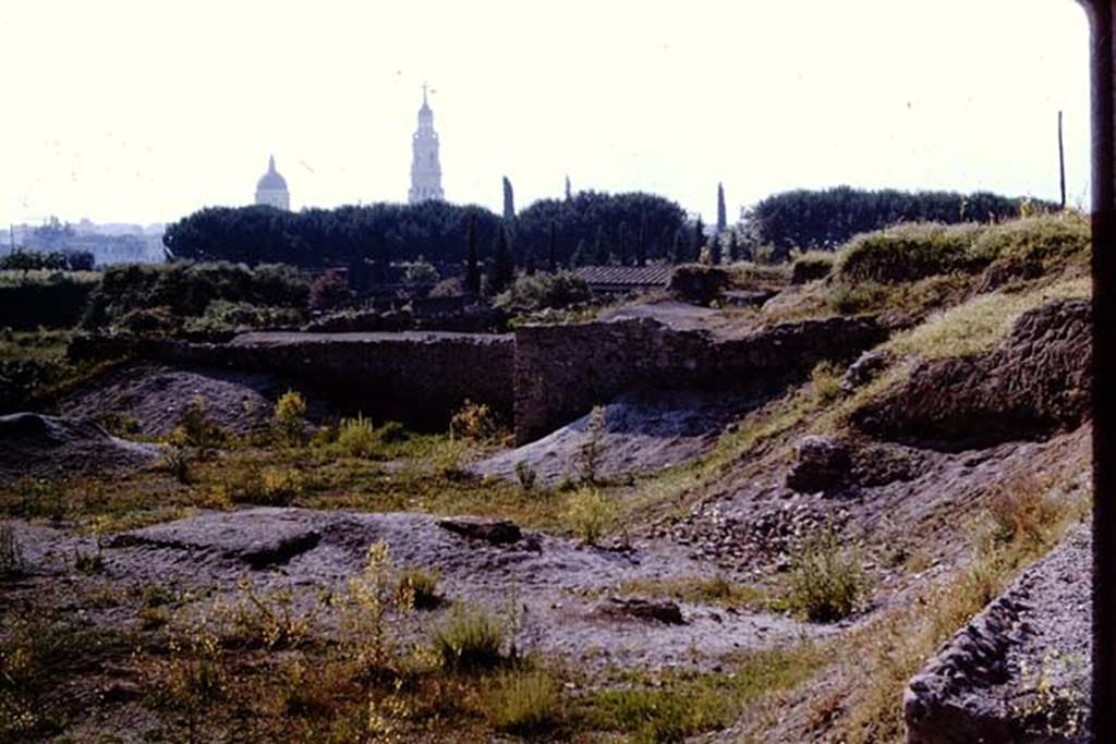 III.7 Pompeii. 1964. Looking south towards remains of triclinium, the ampitheatre and modern Pompeii. Photo by Stanley A. Jashemski.
Source: The Wilhelmina and Stanley A. Jashemski archive in the University of Maryland Library, Special Collections (See collection page) and made available under the Creative Commons Attribution-Non Commercial License v.4. See Licence and use details.
J64f1997