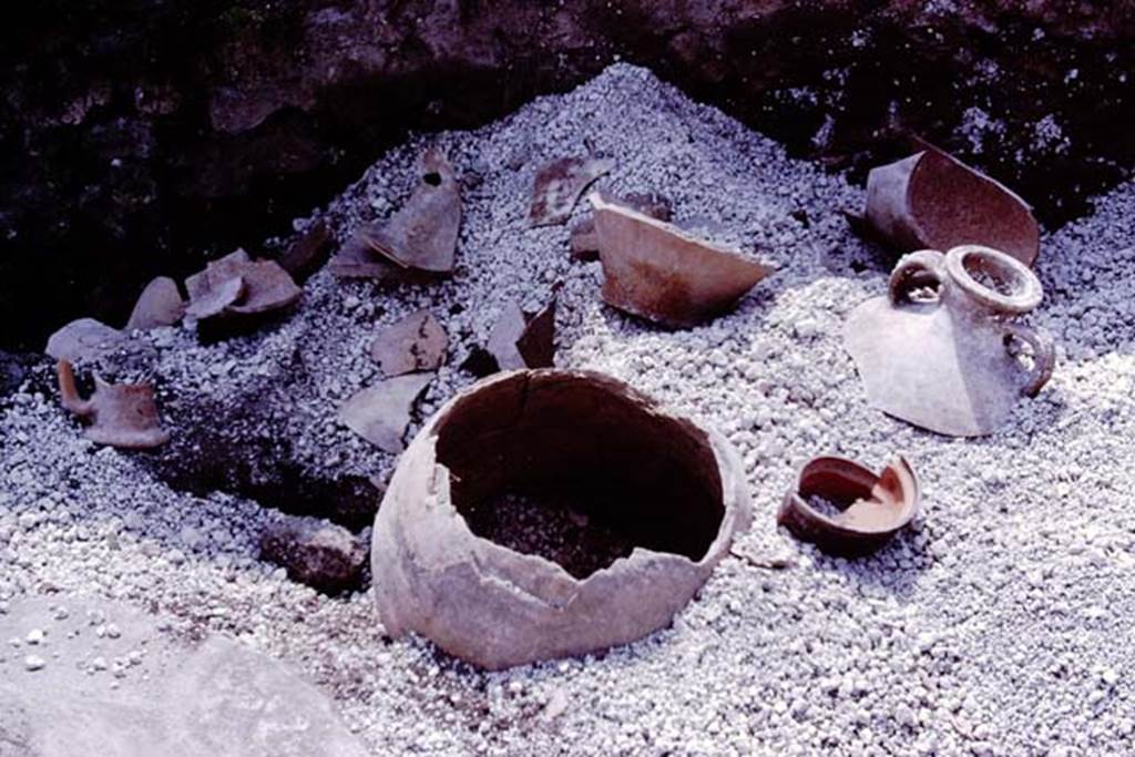 III.7 Pompeii. 1976. Objects emerging from the lapilli. Photo by Stanley A. Jashemski.   
Source: The Wilhelmina and Stanley A. Jashemski archive in the University of Maryland Library, Special Collections (See collection page) and made available under the Creative Commons Attribution-Non Commercial License v.4. See Licence and use details. J76f0427