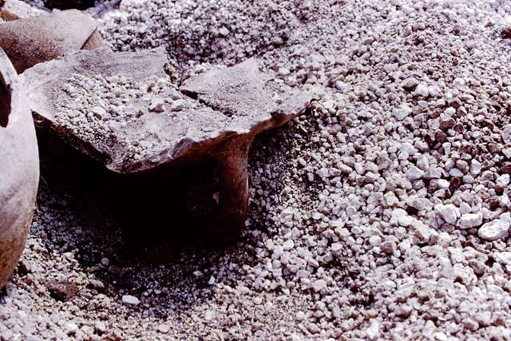 III.7 Pompeii. 1976. Top part of large amphora, used as a brazier. Photo by Stanley A. Jashemski.   
Source: The Wilhelmina and Stanley A. Jashemski archive in the University of Maryland Library, Special Collections (See collection page) and made available under the Creative Commons Attribution-Non Commercial License v.4. See Licence and use details. J76f0433