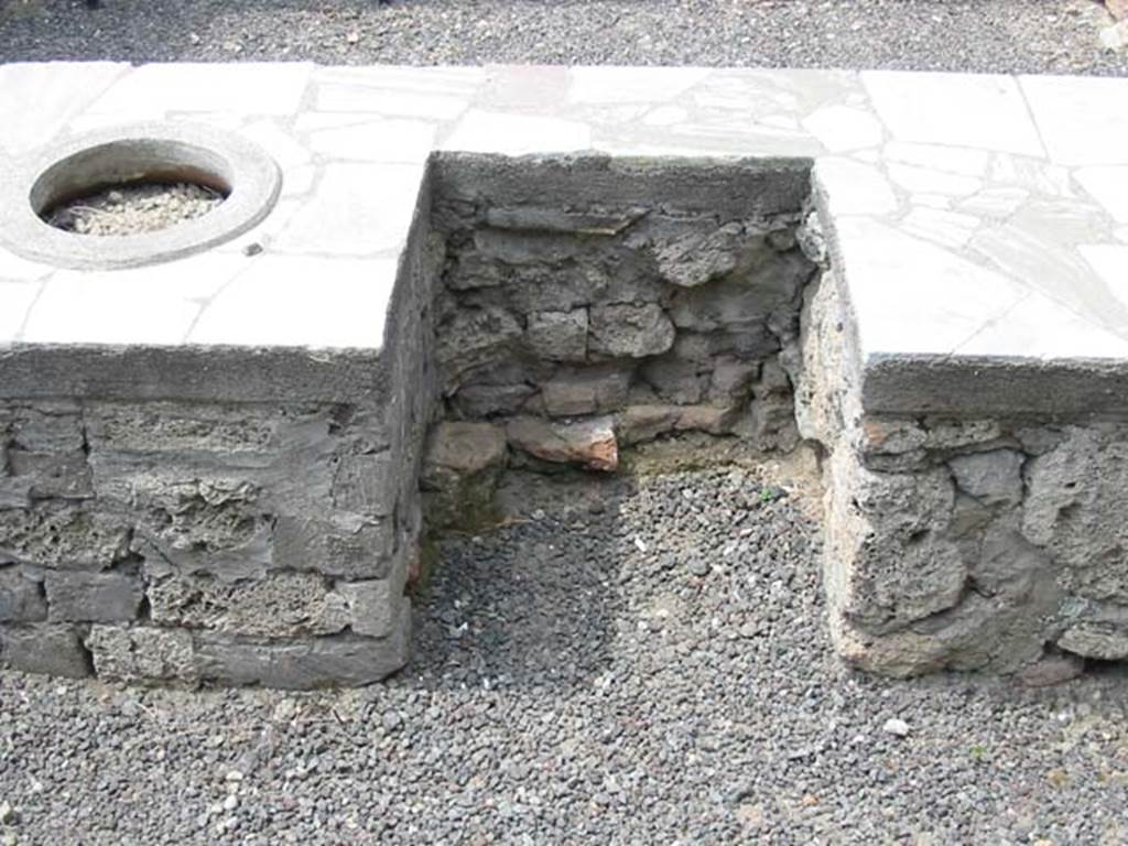 V.1.1 Pompeii. May 2003. Looking towards area of hearth on west side of counter. 
Photo courtesy of Nicolas Monteix.