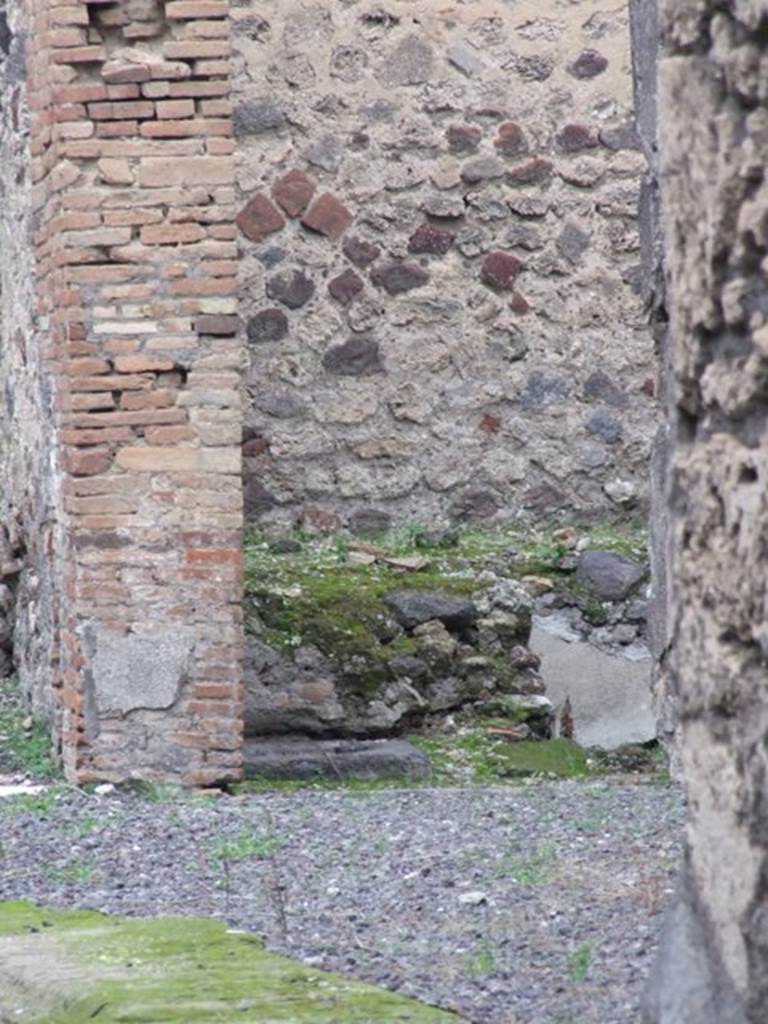V.1.3 Pompeii. December 2007. 
Looking north from the entrance towards room used as a nymphaeum, which had benches on three sides of it and a small pool in the middle.