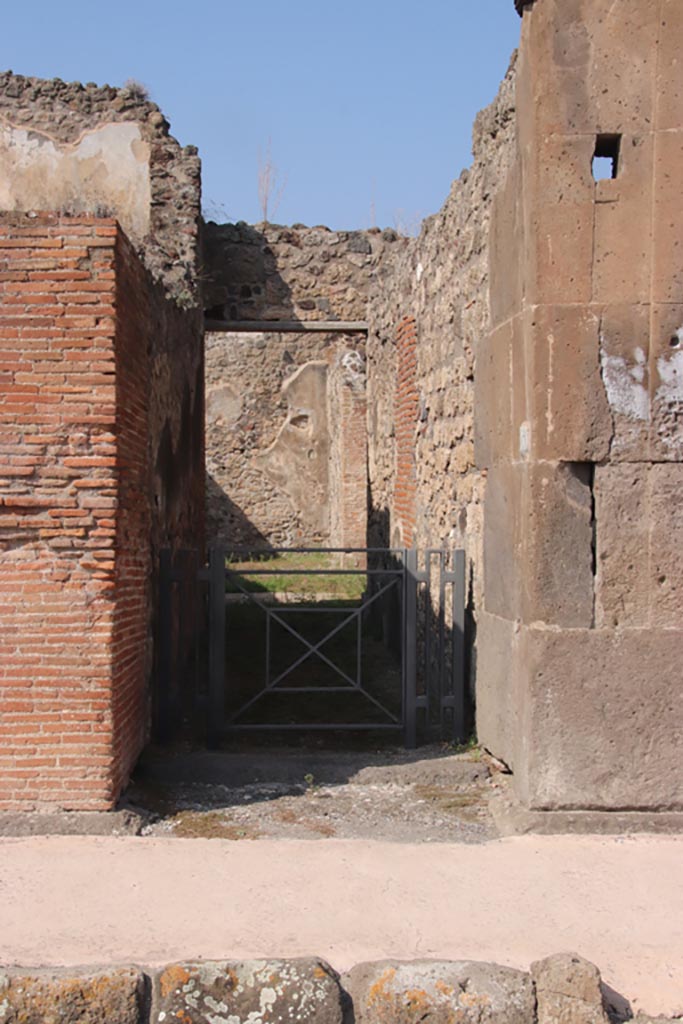 V.1.3 Pompeii. October 2023. 
Looking north through entrance doorway. Photo courtesy of Klaus Heese.
