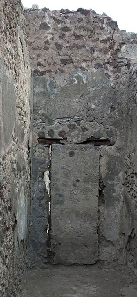 V.1.3 Pompeii. c.2008-10.  
Room 3, east wall of corridor with blocked doorway, which would have linked to V.1.7.
Photo by Hans Thorwid.
Photo courtesy of the Swedish Pompeii Project.