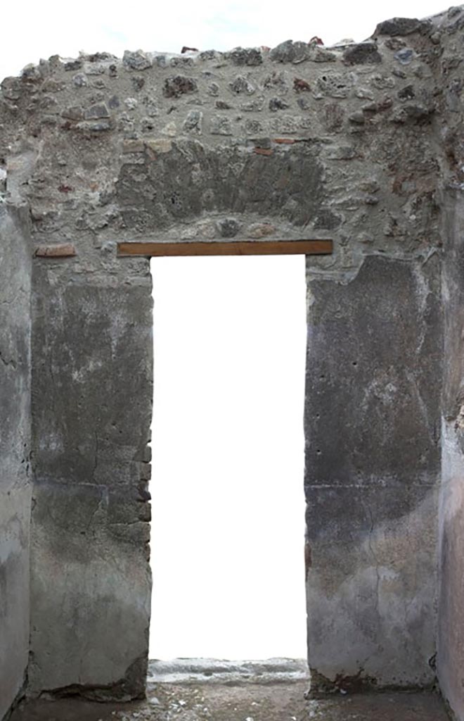 V.1.3 Pompeii. c.2012. 
Room 6, east wall with doorway to atrium, room 2.  
Photo by Hans Thorwid.
“E wall in 2012. Restored parts of the wall photographed and merge with the lower part and floor line of earlier photos from 2005-7.”
Photo and words courtesy of the Swedish Pompeii Project.