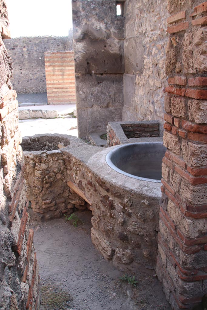 V.1.4 Pompeii. October 2023. 
Looking south from rear room through doorway to entrance room. Photo courtesy of Klaus Heese.