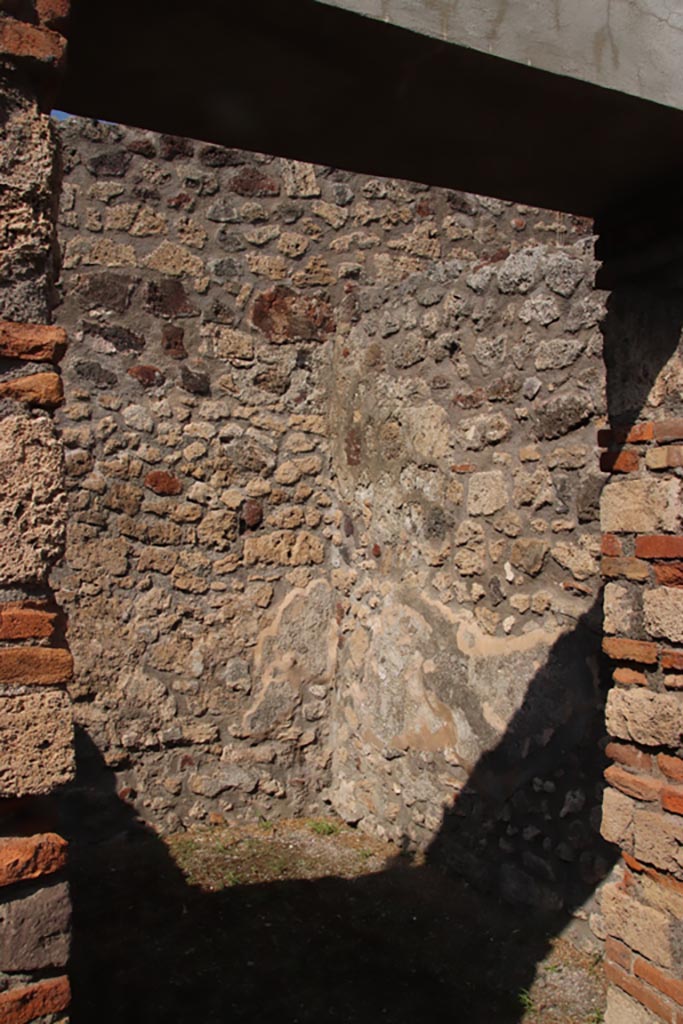 V.1.4 Pompeii. October 2023. 
Looking towards north-east corner and east wall of rear room. Photo courtesy of Klaus Heese.