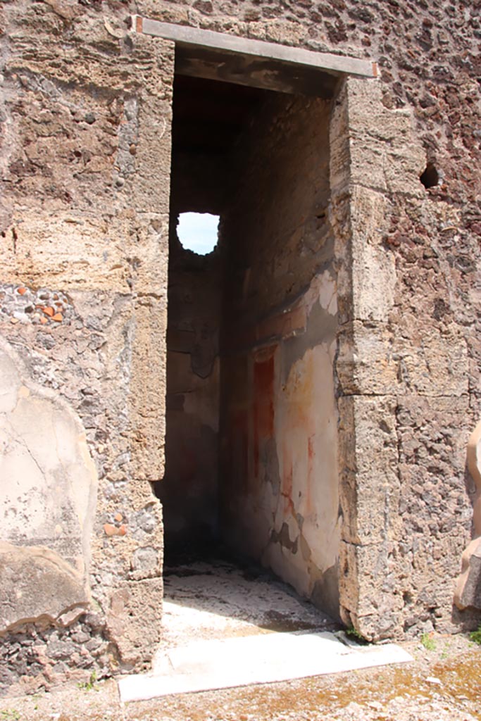 V.1.7 Pompeii. May 2024. 
Doorway to room 7, on east side of atrium. Photo courtesy of Klaus Heese.