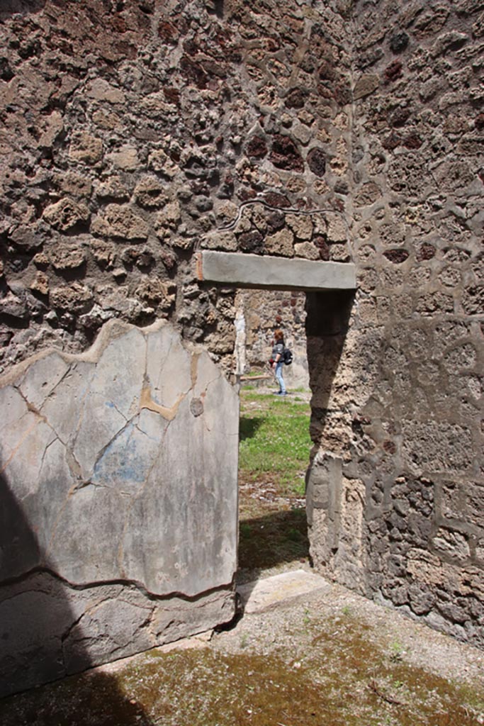 V.1.7 Pompeii. May 2024. 
Room 15, north-east corner, with doorway into room 14. Photo courtesy of Klaus Heese.