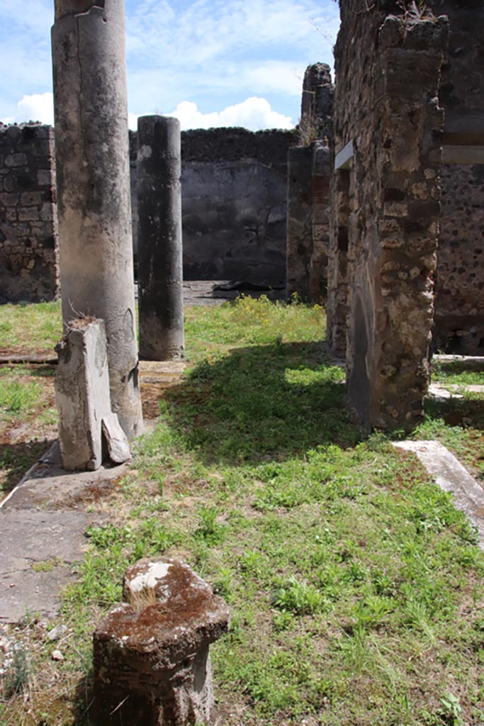 V.1.7 Pompeii. May 2024. 
Looking south along west portico with doorway into room “g”, on right. Photo courtesy of Klaus Heese.