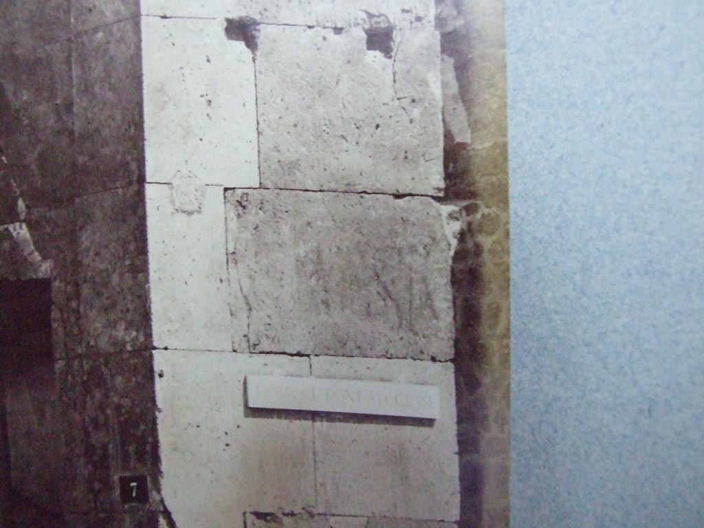 V.1.7 Pompeii. Painted inscription on east side of entrance.
Old undated photograph courtesy of the Society of Antiquaries, Fox Collection.
