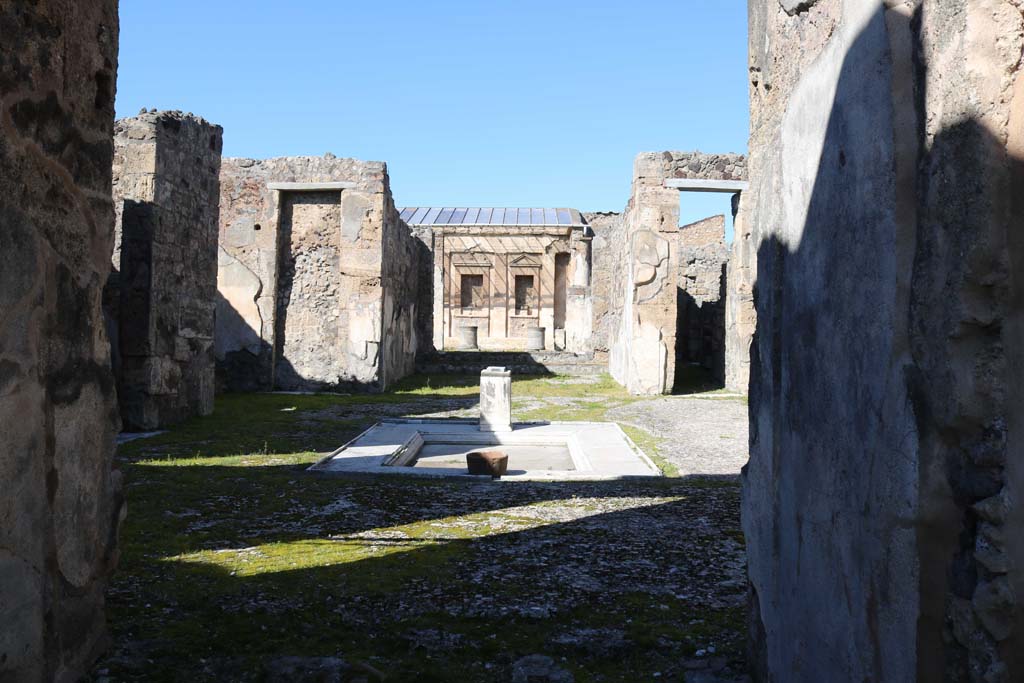 V.1.7 Pompeii. December 2018.  
Room 3, looking north from entrance corridor across impluvium in atrium 4. Photo courtesy of Aude Durand.