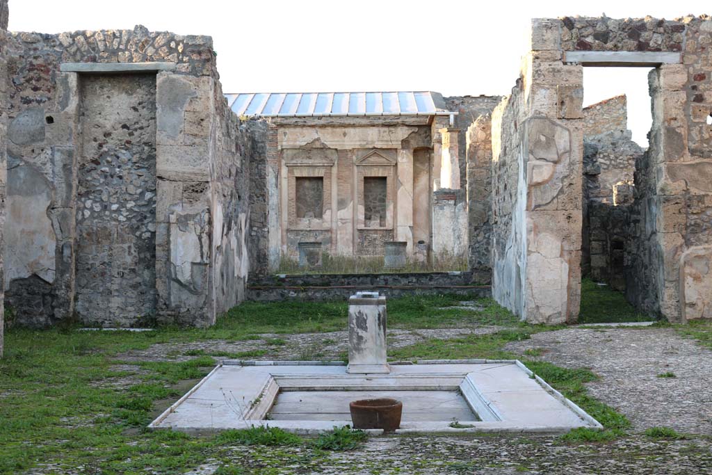 V.1.7, Pompeii. December 2018. 
Room 1, looking north across impluvium in atrium, from entrance corridor. Photo courtesy of Aude Durand.