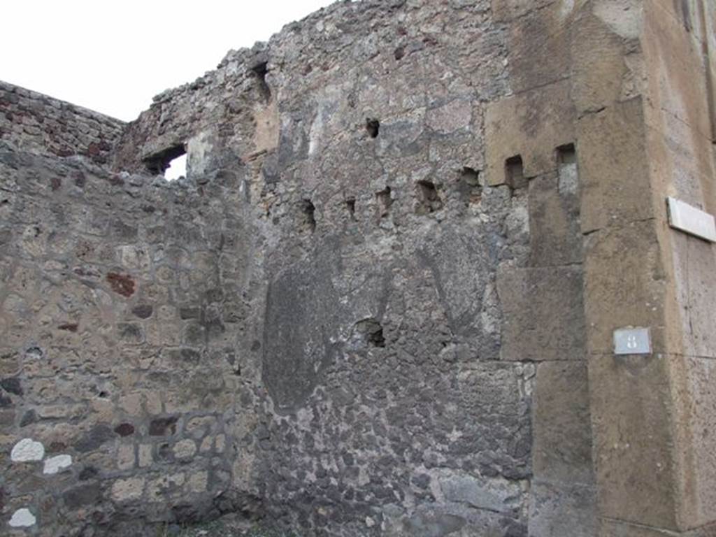 V.1.8 Pompeii. December 2007. East wall of shop with upper storey latrine, centre left.