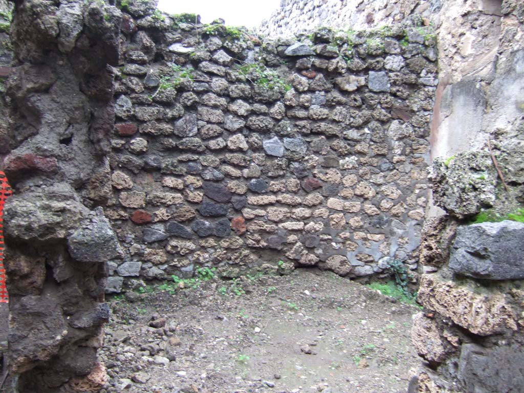 V.1.11 Pompeii. December 2005. 
Looking north through doorway towards north-west corner of room. This room was on the north side of the corridor.