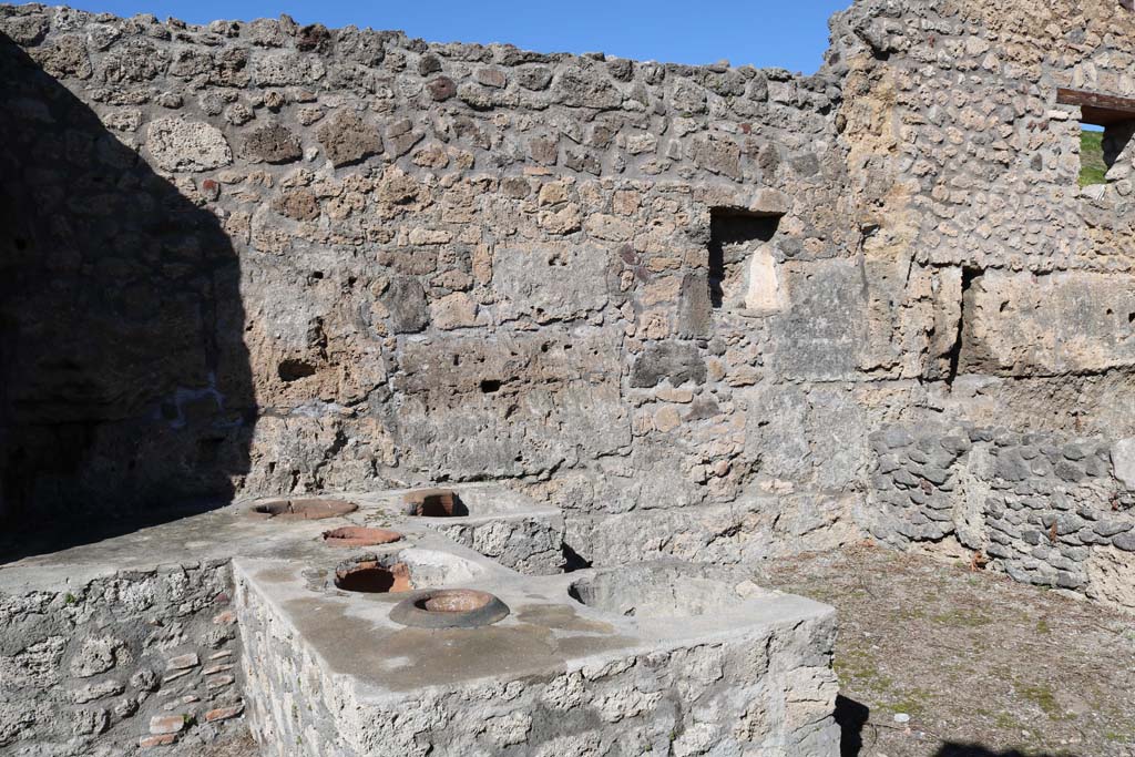 V.1.13 Pompeii. December 2018. 
Looking across counter towards north wall with square niche/recess in bar-room. Photo courtesy of Aude Durand.