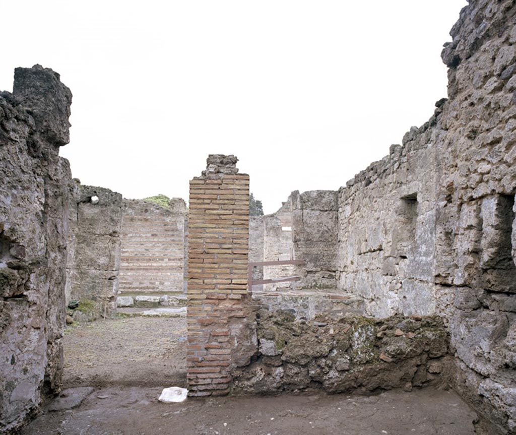 V.1.13 Pompeii. c.2004-6?   
Looking towards doorway to bar-room in west wall of rear room. Photo by Hans Thorwid. 
Photo courtesy of the Swedish Pompeii Project.
