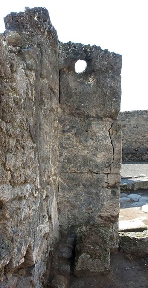 V.1.13 Pompeii.  c.2004-6? 
Looking towards west wall in south-west corner of bar-room.
Photo by Hans Thorwid. 
“The remains of a built structure are visible in the SW corner. 
Mau reported a small lead container, identified as a hearth, at this location, below the small rounded window serving as a smoke outlet.”
Photo and words courtesy of the Swedish Pompeii Project.