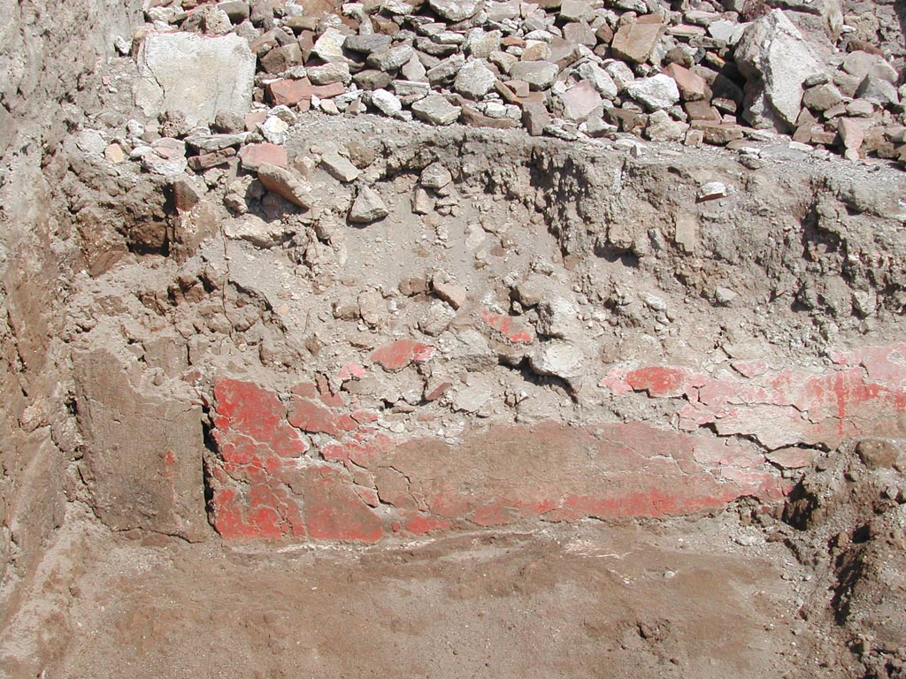 V.1.15 Pompeii. 2003.  
“The red plaster on the pluteus facing the ambulatory in 2003. The plaster was in very bad condition.” 
Photo by Henrik Boman.  
Photo and words courtesy of the Swedish Pompeii Project.