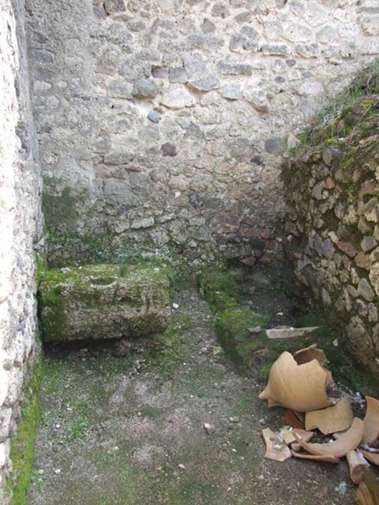 V.1.15 Pompeii. April 2009. 
Looking south through doorway into kitchen/latrine in south-east corner of bakery