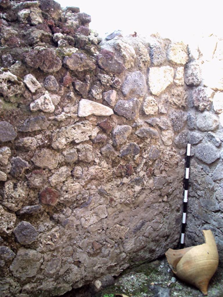 V.1.15 Pompeii. September 2009. North-west corner of kitchen.
The west wall of this room was part of the oven. Photo courtesy of Jared Benton.