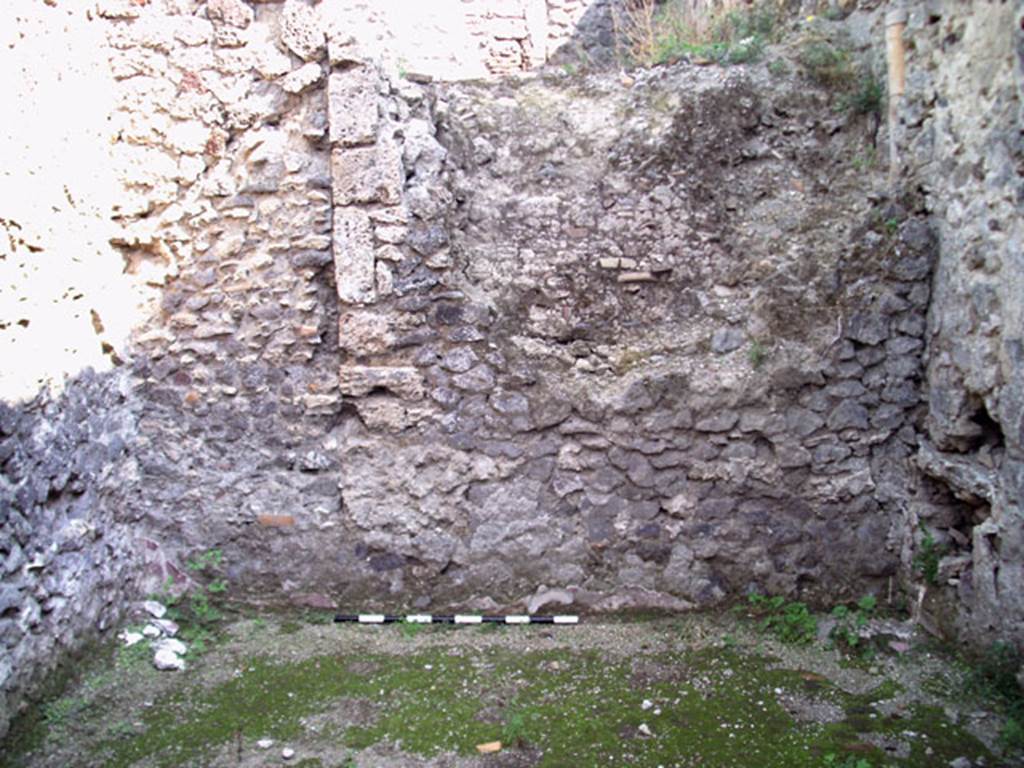 V.1.15 Pompeii. September 2009. Room in bakery on west side of oven showing east wall and the side of the large oven. Photo courtesy of Jared Benton.