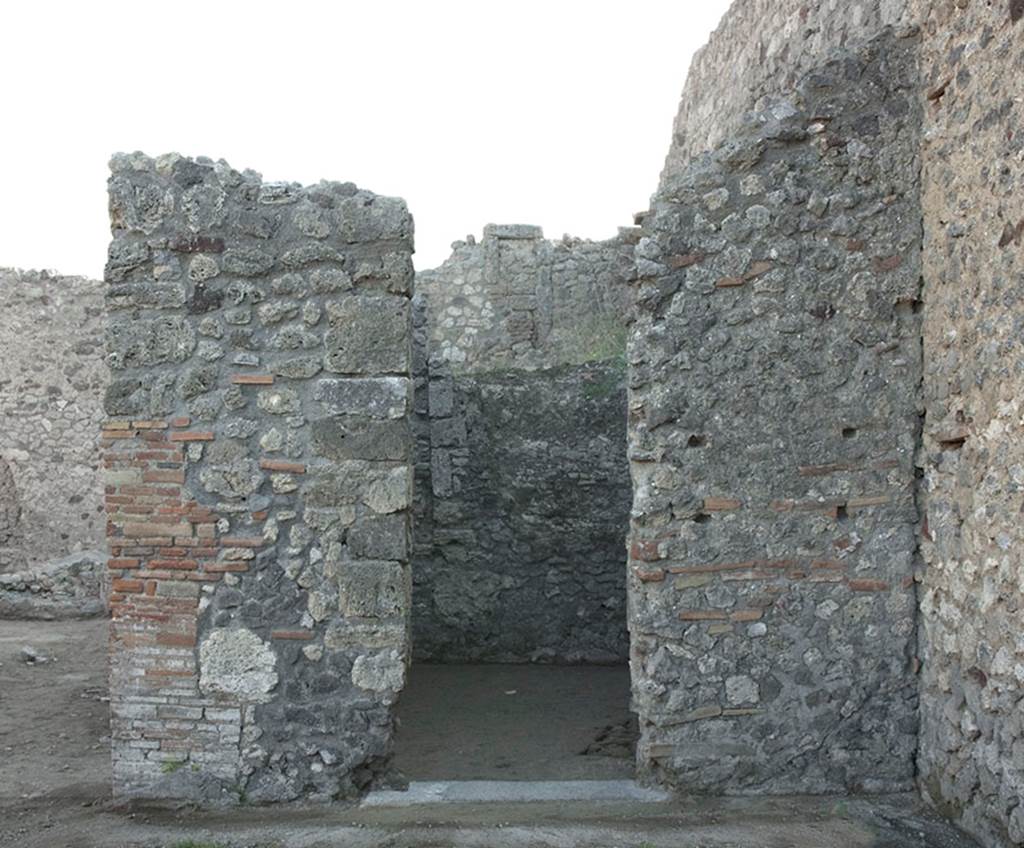 V.1.15 Pompeii. 2012. 
East wall of atrium on south side, with doorway into room after restoration in 2008.
Photo by Hans Thorwid. 
Photo courtesy of the Swedish Pompeii Project, (see room f)