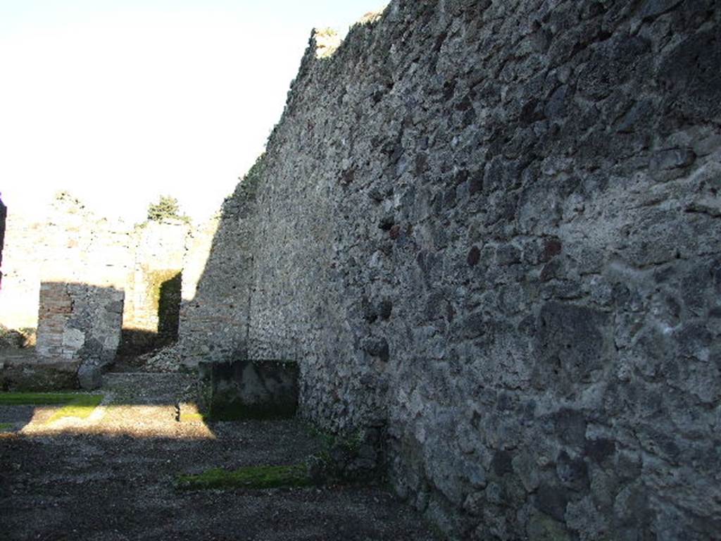 V.I.16 Pompeii. December 2006. Bakery shop, looking towards south wall of shop and atrium of V.1.15 to rear.
