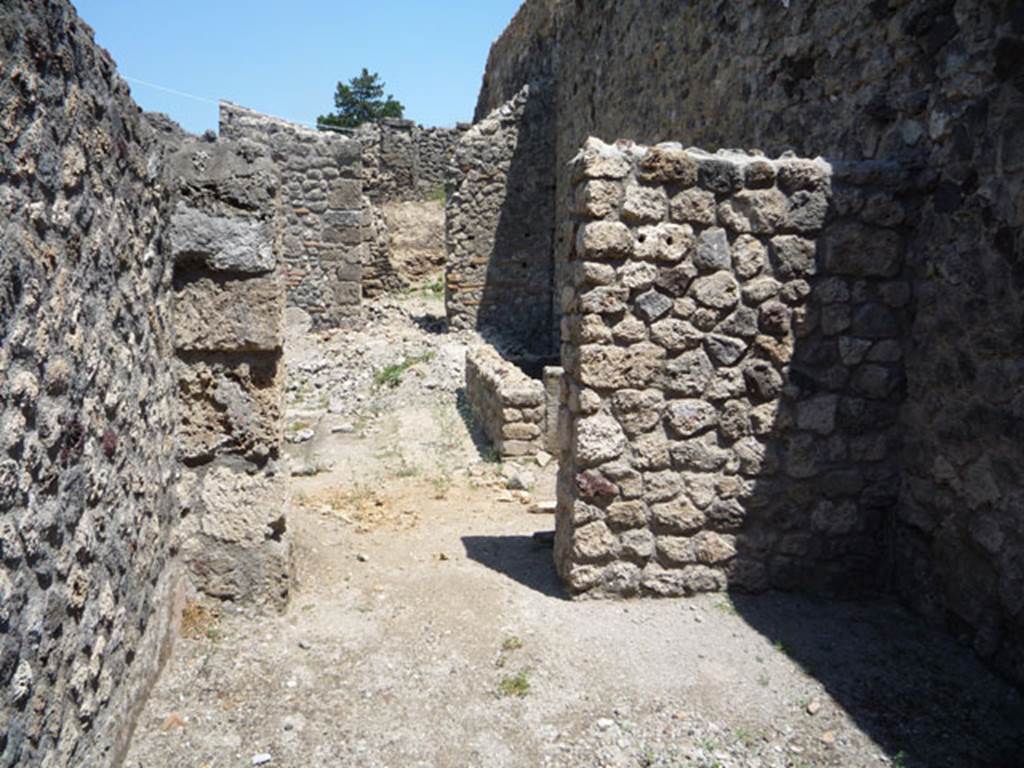 V.1.16 Pompeii. July 2008. Looking east towards newly rebuilt east wall with doorway to atrium of V.1.15. Photo courtesy of Jared Benton.