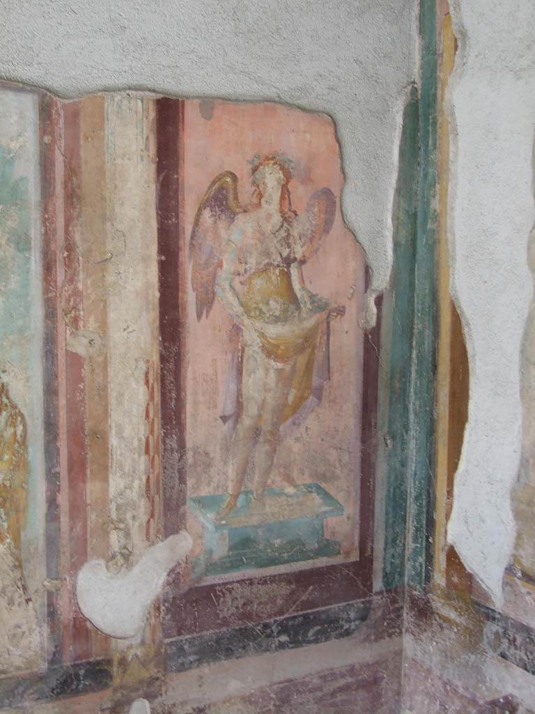 V.1.18 Pompeii. March 2009. West wall of exedra “y”, north end.   
Wall painting of a winged figure possibly a muse.
See Leach, E.W., 2004. The Social Life of Painting in Ancient Rome and on the Bay of Naples. Cambridge UK: Cambridge UP. (p.135).
