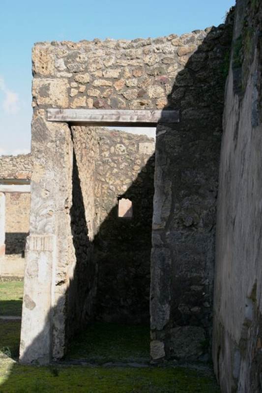 V.1.18 Pompeii. c.2012.   
Looking towards doorway to room “f” in east wall in south-east corner of atrium. Photo by Thomas Staub. 
Photo courtesy of The Swedish Pompeii Project.