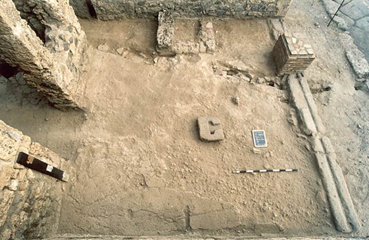 V.1.20 Pompeii. 2001. 
Looking down on floor in shop-room, from north side. Photo by Henrik Boman.
Photo courtesy of The Swedish Pompeii Project.