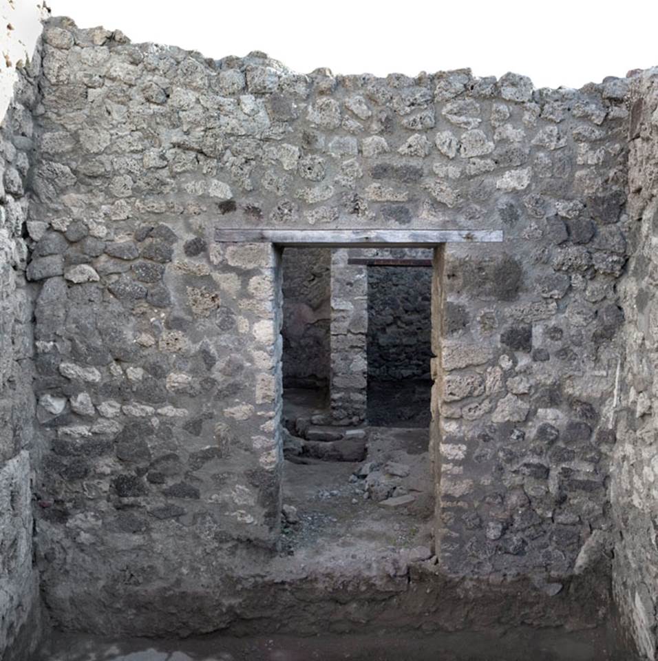 V.1.20 Pompeii. 2012. Room “b”. Photo by Hans Thorwid.
“Looking towards east wall of rear room, after restoration in 2008.
Restored parts of the wall photographed and merge with the lower part and floor line of earlier photos from 2005-07.” 
Photo and words courtesy of The Swedish Pompeii Project.