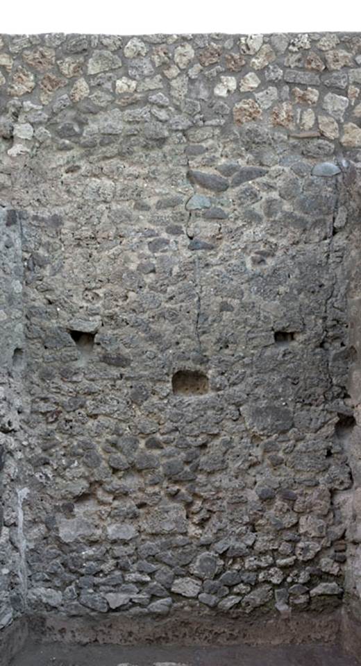 V.1.20 Pompeii. 2012. Room “e”. Photo by Hans Thorwid.
“East wall of room in rear south-east corner, in 2012 after restoration.   
Restored parts of the wall photographed and merge with the lower part and floor line of earlier photos from 2005-07.”
Photo and words courtesy of The Swedish Pompeii Project.
