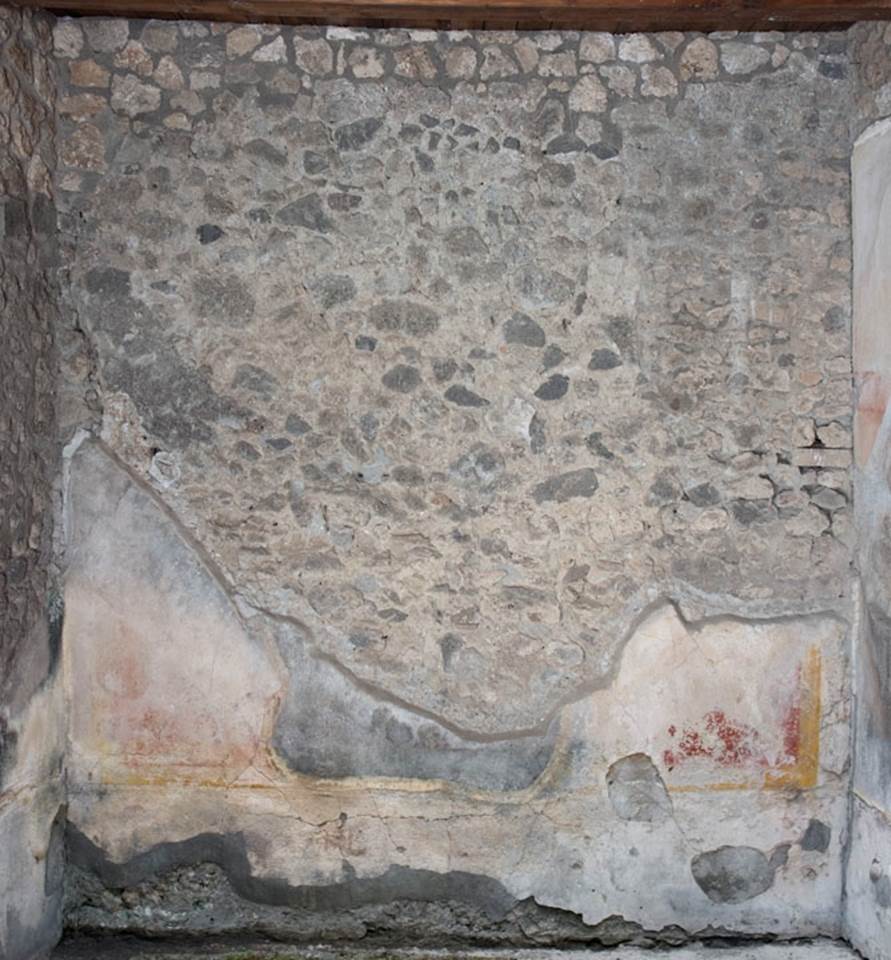 V.1.23 Pompeii. 2012.  
Room “k”, west wall of room on north side of tablinum area. Photo by Hans Thorwid.
“West wall in room in 2012, after the reconstruction in 2008 when the room was roofed.
Restored parts of the wall photographed and merge with the lower part and floor line of earlier photos from 2005-07.”
Photo and words courtesy of the Swedish Pompeii Project.