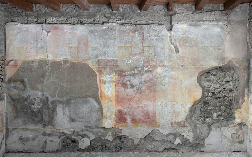 V.1.23 Pompeii. 2012. Room “k”, north wall of triclinium. Photo by Hans Thorwid.
“West wall in room in 2012, after the reconstruction in 2008 when the room was roofed.
Restored parts of the wall photographed and merge with the lower part and floor line of earlier photos from 2005-07.”
Photo and words courtesy of the Swedish Pompeii Project.