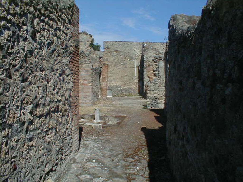 V.1.23 Pompeii. September 2004. Looking east from entrance.
According to Garcia y Garcia, during the aerial bombardment of the night of 16th September 1943, the entrance corridor and three surrounding rooms were destroyed.
See Garcia y Garcia, L., 2006. Danni di guerra a Pompei. Rome: L’Erma di Bretschneider. (p.62)