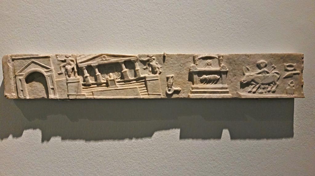 V.1.26 Pompeii. December 2019.
Marble slab from side of household altar in atrium, on display in exhibition “Pompei e Santorini”, Rome, 2019. 
Photo courtesy of Giuseppe Ciaramella.