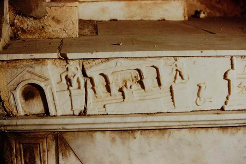 V.I.26 Pompeii. 1957. Marble slab with detail of scenes of the Forum in the earthquake of AD62, on side of household altar in atrium. Photo by Stanley A. Jashemski.
Source: The Wilhelmina and Stanley A. Jashemski archive in the University of Maryland Library, Special Collections (See collection page) and made available under the Creative Commons Attribution-Non Commercial License v.4. See Licence and use details.
J57f0413