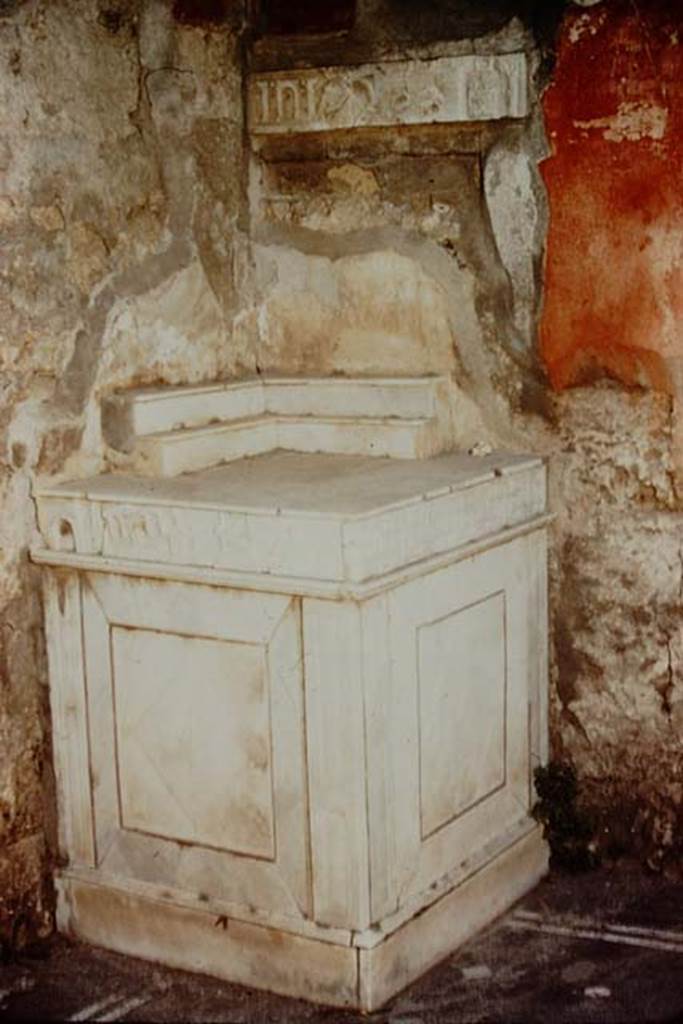 V.I.26 Pompeii. 1957.  Household altar in atrium. Photo by Stanley A. Jashemski.
Source: The Wilhelmina and Stanley A. Jashemski archive in the University of Maryland Library, Special Collections (See collection page) and made available under the Creative Commons Attribution-Non Commercial License v.4. See Licence and use details.
J57f0415