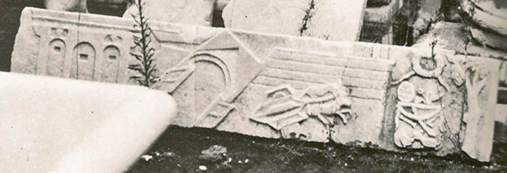 V.1.26 Pompeii. Mid 1880s. Detail from old photograph of items in storage. 
Marble slab from above the household altar in atrium.
Scene of the Castellum Acquae and Vesuvian Gate in the earthquake of AD62.