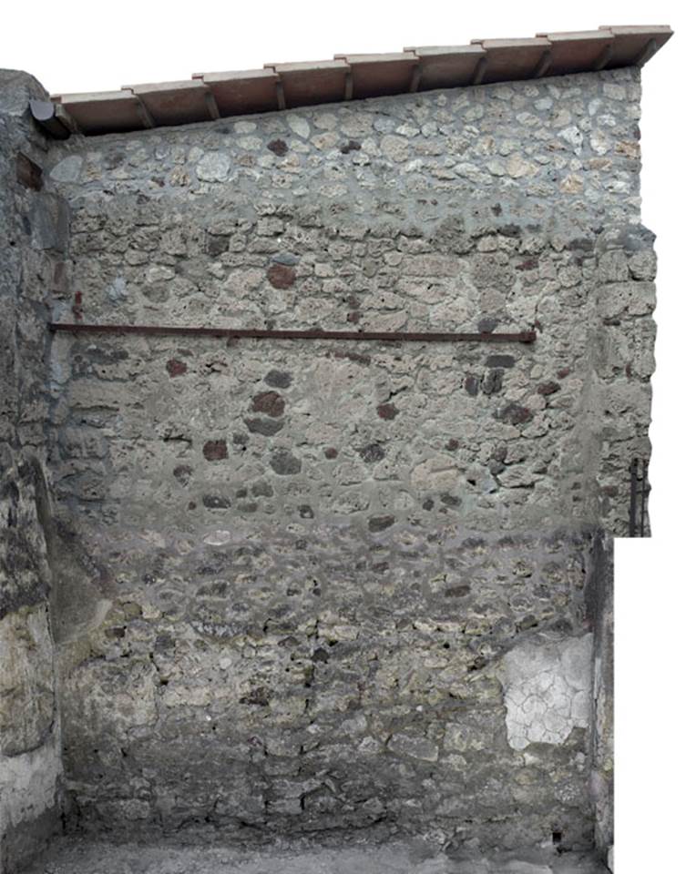 V.1.27 Pompeii. c.2012.  
North wall of shop. Photo by Hans Thorwid.
“Restored part of the wall photographed and merge with the lower part and floor line of earlier photos from 2005-07.”
Photo and words courtesy of The Swedish Pompeii Project.