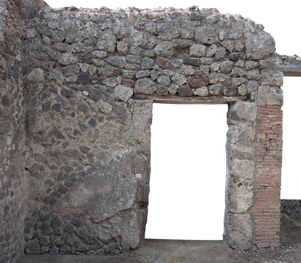 V.1.28 Pompeii. c.2008-10.  
West wall of atrium/room “b”, in south-west corner, with doorway to room “e”. Photo by Hans Thorwid.
Photo courtesy of The Swedish Pompeii Project.